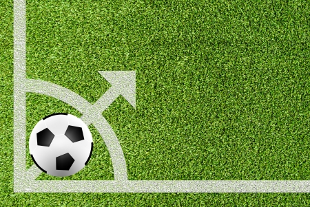 soccer ball on point line of artificial grass fieldの写真素材