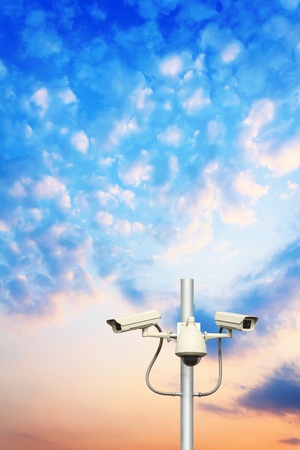 traffic cameras with sunset backgroundの写真素材