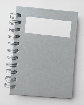 cover paper notebook with label on white background.の写真素材