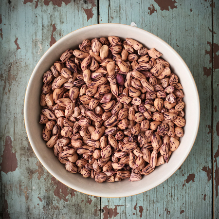 fresh tiger peanuts in bowl on wood background.の写真素材