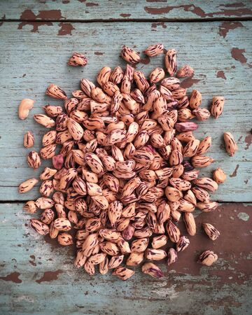 fresh tiger peanuts on wood background.