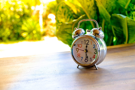 Alarm clock in the morning and sun
