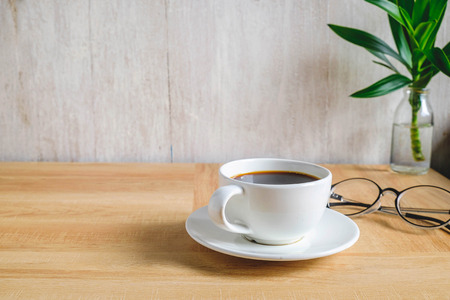 Coffee cup on work tableの写真素材