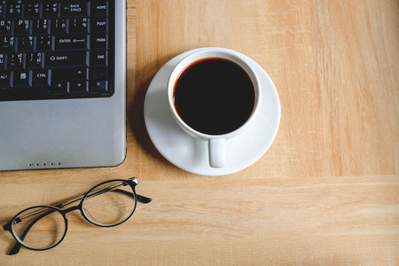Coffee cup on work tableの写真素材