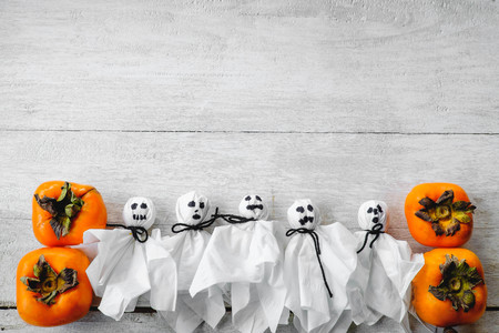 Pumpkins and ghosts on Halloweenの写真素材