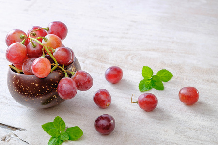 Fresh grapes from the vineyard on white table.の写真素材