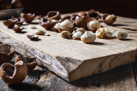 Organic Macadamia nut on woodenの写真素材