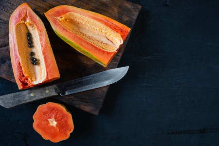 Papaya. Tropical Fruits. On a wooden backgroundの写真素材