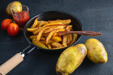 Cook fried potatoesの写真素材
