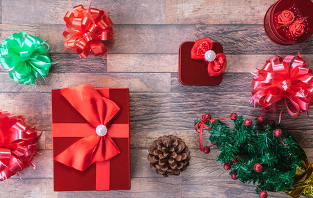 Christmas gift boxes and  on wooden background.