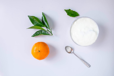 Natural yogurt and citrus fruit On a white background