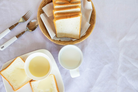 Breakfast, bread and milk on the tableの写真素材