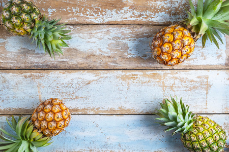 Pineapple fruit on a wooden backgroundの写真素材
