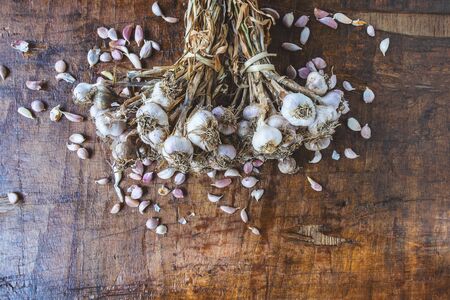 Garlic and garlic on wooden background