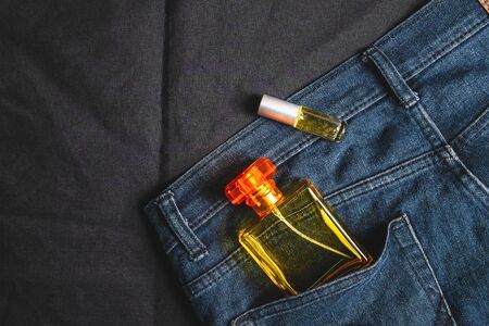 Perfume bottles and fragrances in jeans bagsの写真素材