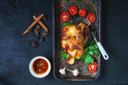 Grilled chicken dishes and dipping sauce From the oven on a black backgroundの写真素材