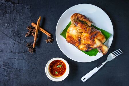Fresh grilled chicken dishes in a dish and dipping sauce servedの写真素材