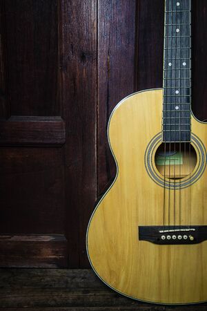 Classical guitar on old wooden backgroundの写真素材