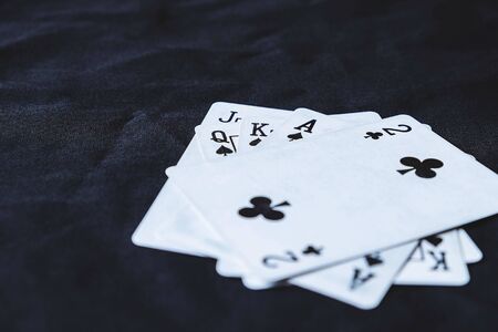 Gambling cards on a black cloth background