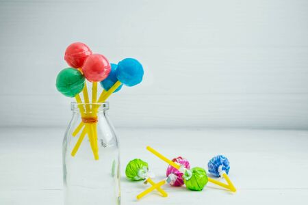 The sweet lollipops of the children on the tableの写真素材