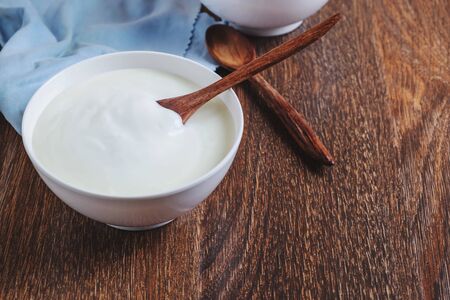 Natural yogurt On a wooden backgroundの写真素材