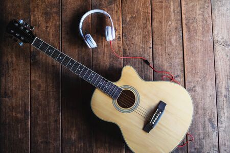 Classical guitar and music headphones