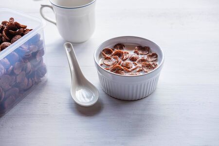 Breakfast cereal with fresh milk on the white table