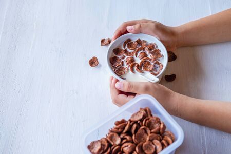 Breakfast cereal with fresh milk on the white table