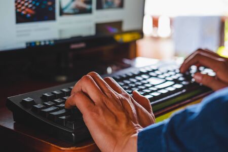 An office man sitting and working with a computerの写真素材
