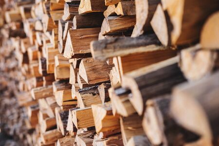 Stacked firewood backgroundの写真素材