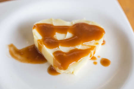 Mashed potato heart-shaped with gravy poured overの写真素材