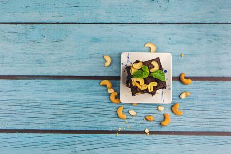 Topview Homemade chocolate brownie on a blue wood background , bakery and dessertの写真素材