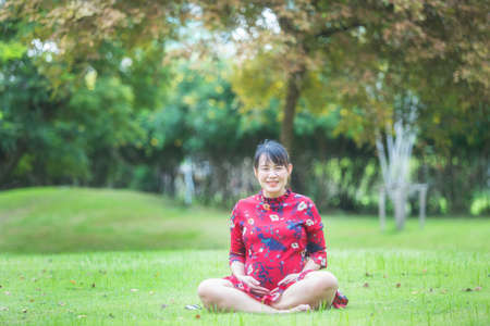 pregnant woman relaxing and happy in the parkの写真素材