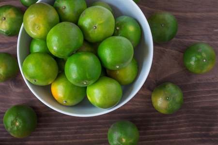 green orange on the tableの写真素材