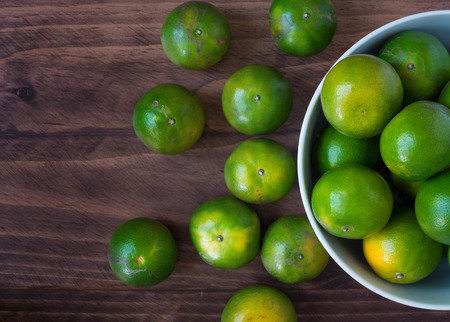 green orange on the tableの写真素材