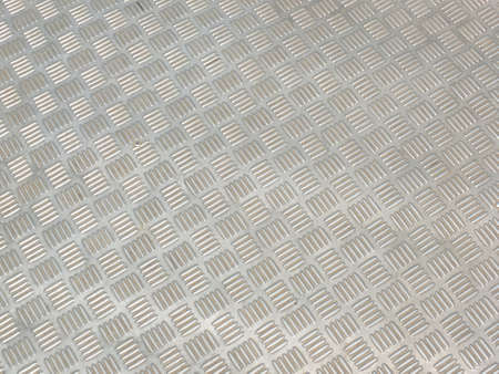 Silver plate with alternating stripes used as a walkwayの写真素材