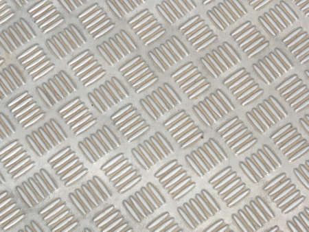 Silver plate with alternating stripes used as a walkwayの写真素材