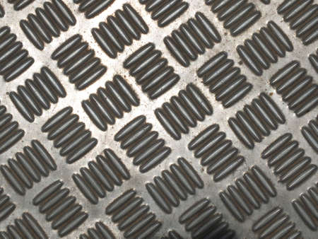 Silver plate with alternating stripes used as a walkwayの写真素材