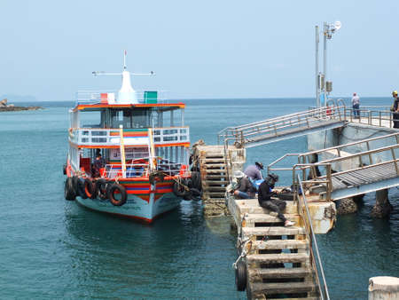 Koh Larn, Thailand March 21, 2021 is a picture of local fishermen fishing at the jettyのeditorial素材