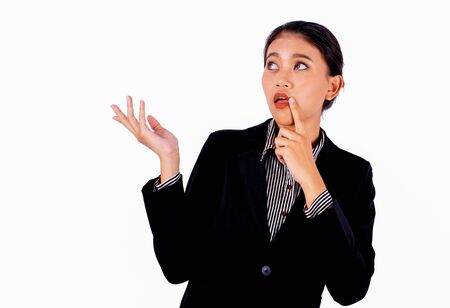Asian beautiful business woman is acting by shrugged pose on white background and also look to her right side show curious emotion.の写真素材