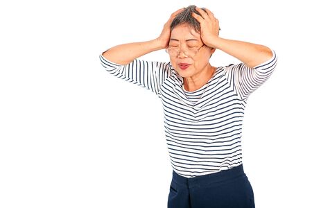 One Asian elderly woman express action of headache or head pain and isolate on white background with copy space.の写真素材