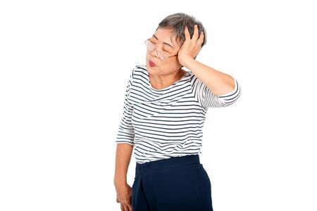 One Asian elderly woman express action of headache or head pain and isolate on white background with copy space.の写真素材
