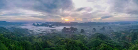 Aerial and Panorama view of Doi Tapang show fog or mist cover some part of area with sunrise light.の写真素材