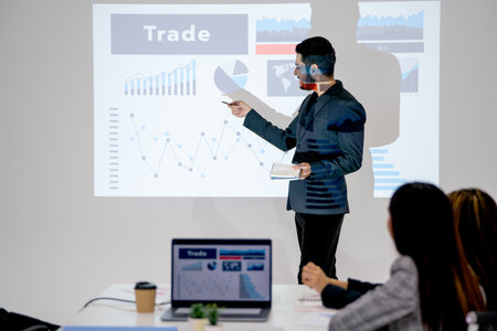 Business man look like lbgt style present about the project in meeting room and coworkers express happy and enjoy the presentation.の写真素材
