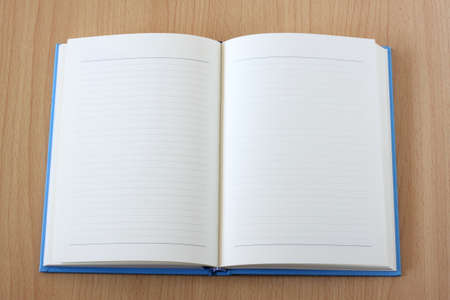 Open Note Book On Wood Background