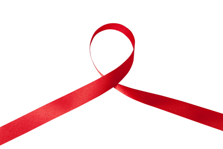 Shiny red ribbon on white backgroundの写真素材