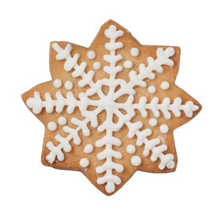 Gingerbread cookie in snowflake shape isolated on white, clipping pathの写真素材