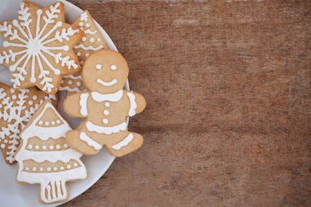 Christmas homemade gingerbread cookies on wooden tableの写真素材