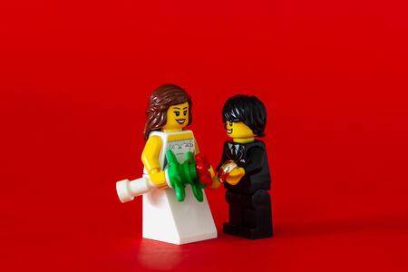 Bangkok,Thailand. January 19,2020 - Wedding Couple of lego minifigure. bride and groom on red background. Studio Shotのeditorial素材