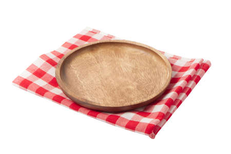 Wooden board stand on tablecloth isolated on white background.For mock up food menu.の写真素材